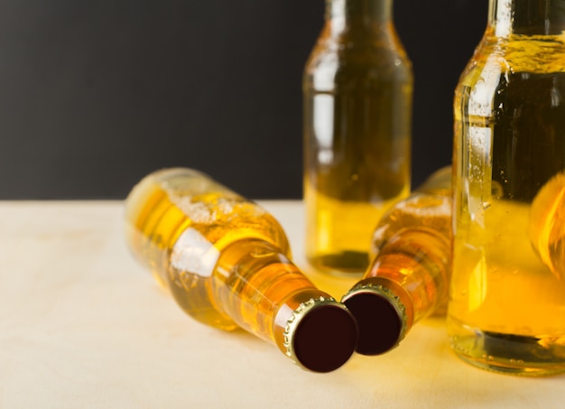 Beer bottles on a wooden table .