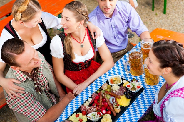 In Beer garden - friends on a table with beer