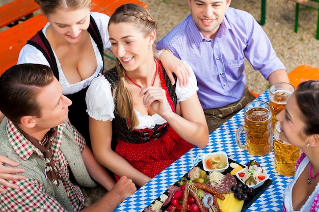 In Beer garden - friends on a table with beer