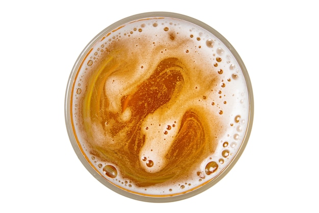 Beer in glass. Beer foam with bubble. View from above.