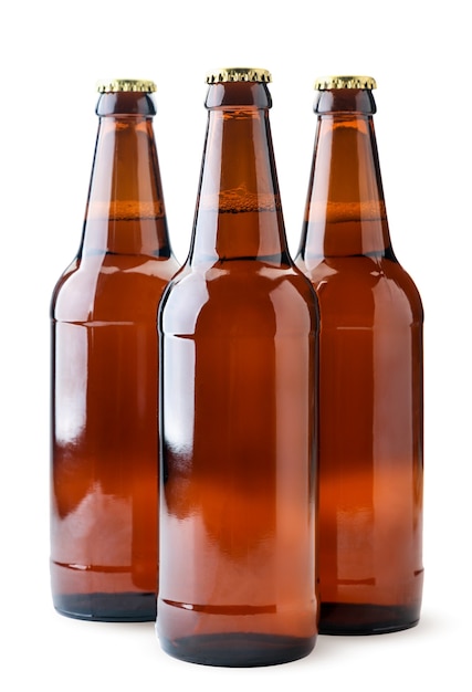 Beer in glass bottles close-up on a white background. Isolated