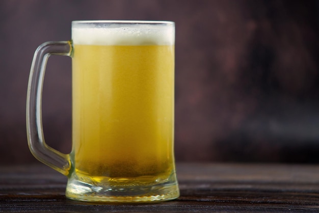 beer in a glass on a dark background