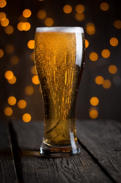 Beer in glass on dark table