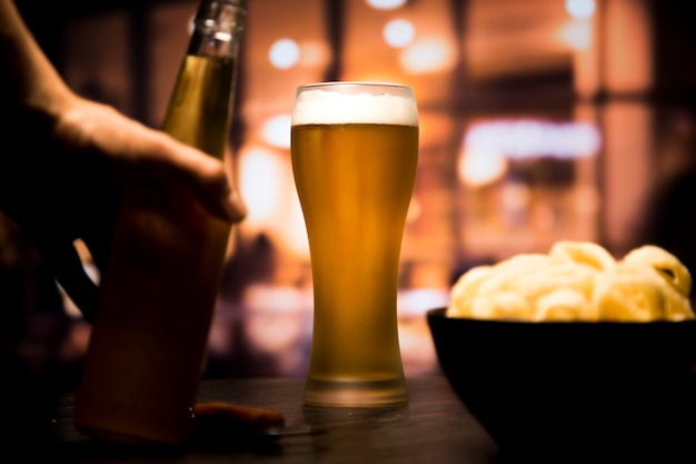 Beer glass in front of blurred background