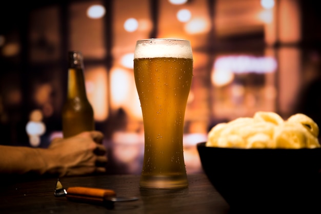 Beer glass in front of blurred background