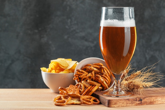 Beer glass with snacks