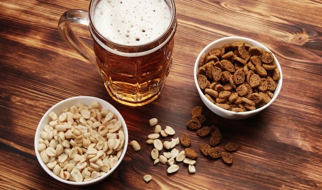 Photo beer in a mug and snack