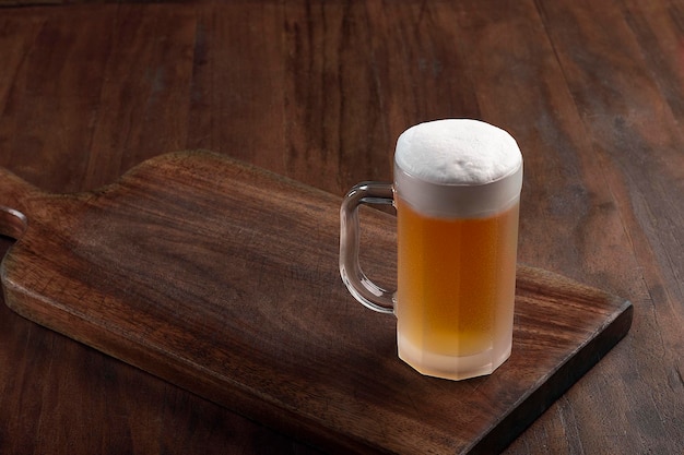 Beer mug on wooden board