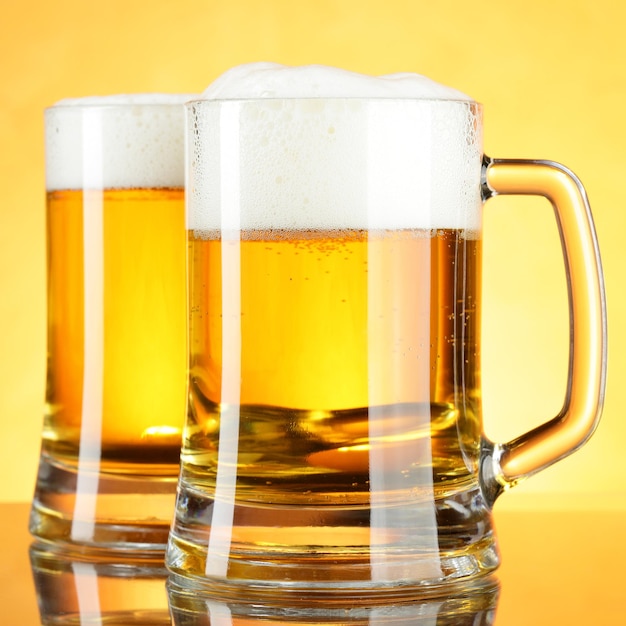 Beer mugs with froth close up