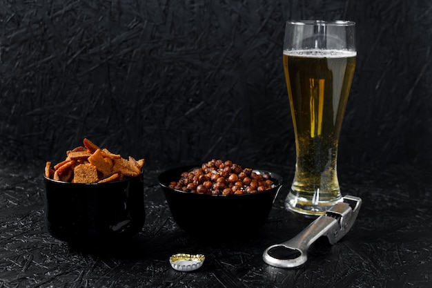 Beer snacks. Beer on a dark background.