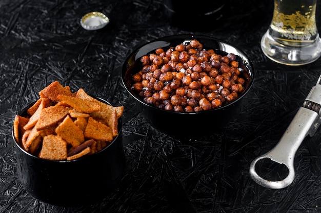 Beer snacks. Beer on a dark background.