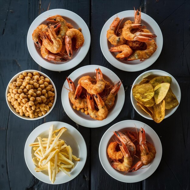 Photo beer snacks plates of fried dushbara shrimps boiled chickpeas pistachio chips string cheese