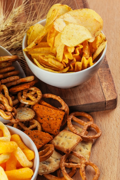 Beer snacks on stone and wooden . Top view, copy space