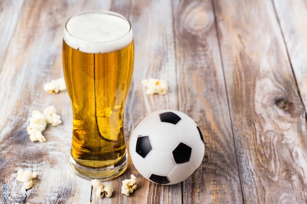 Beer and snacks on wooden table