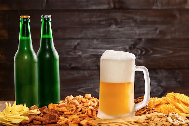 Beer and snacks on a wooden table
