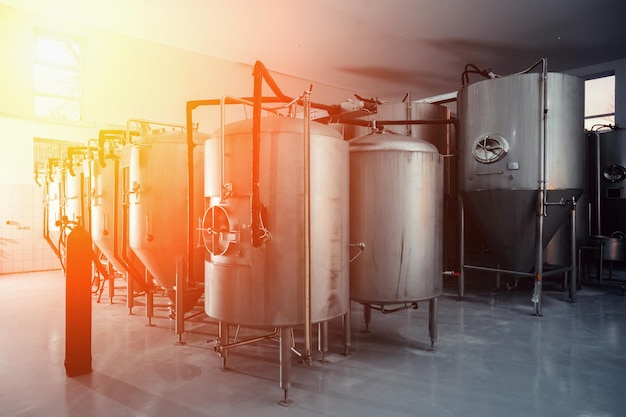 Beer tanks at brewery with modern equipment