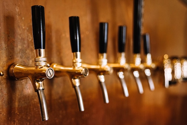 Beer tap many in a row bar interior copper wall