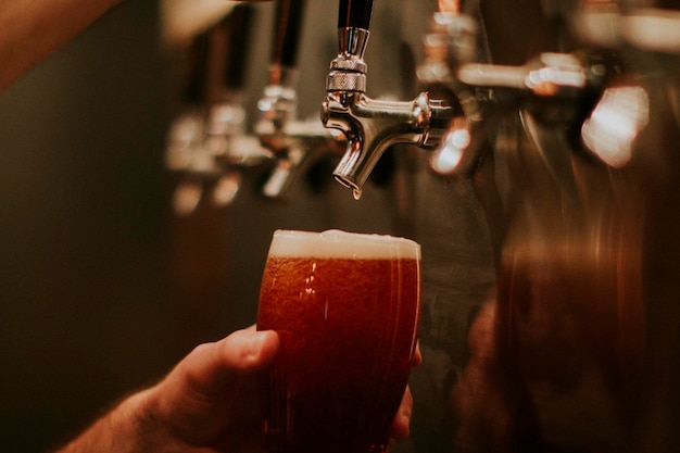 Photo beer tap pouring beer