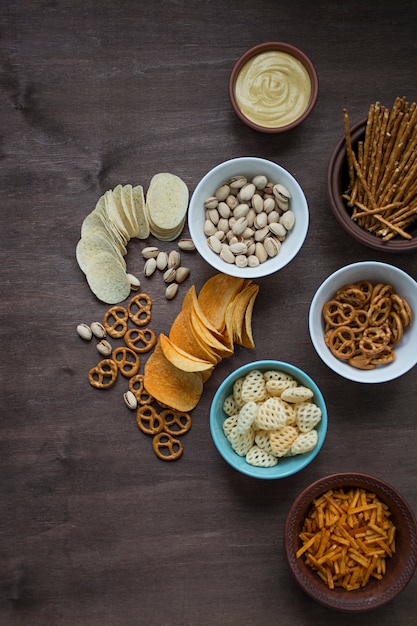 Beer with pretzels and various snacks