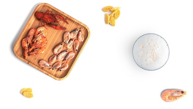 Beer with seafood snacks on a white background. High quality photo