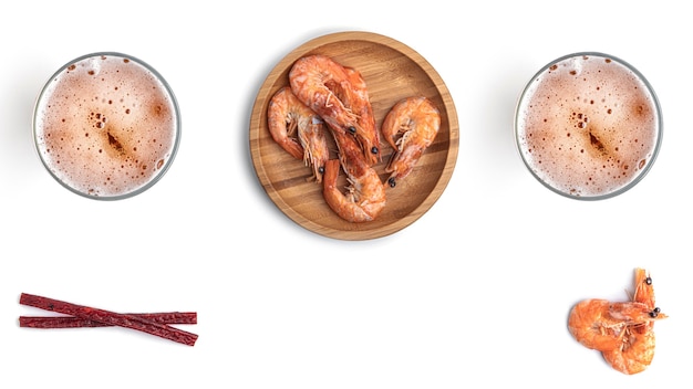 Beer with seafood snacks on a white background