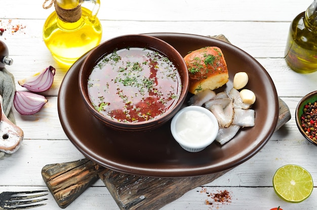 Beet borsch with lard and sour cream Ukrainian cuisine Top view free space for your text Rustic style