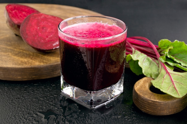 Beet fresh juice on a dark background.