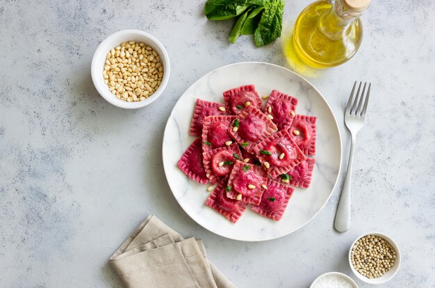 Beet ravioli with ricotta cheese, spinach and nuts. Healthy eating. Vegetarian food. Italian cuisine.