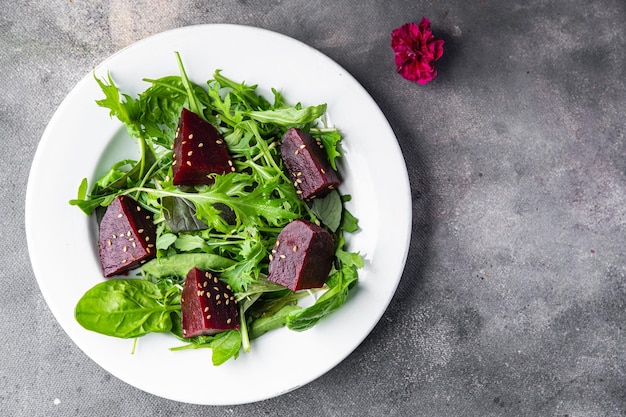 beet salad beetroot pieces mix green lettuce healthy meal food snack on the table copy space food