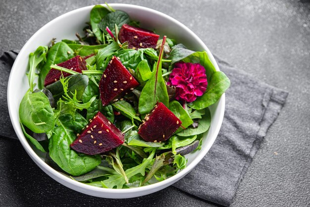 beet salad beetroot pieces mix green lettuce healthy meal food snack on the table copy space food