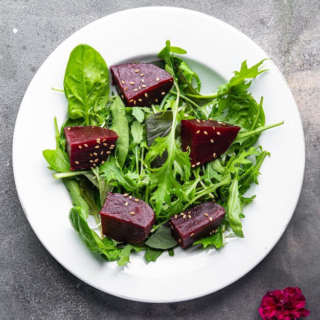 beet salad beetroot pieces mix green lettuce healthy meal food snack on the table copy space food