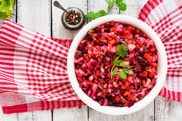 Beet salad Vinaigrette in a white bowl.