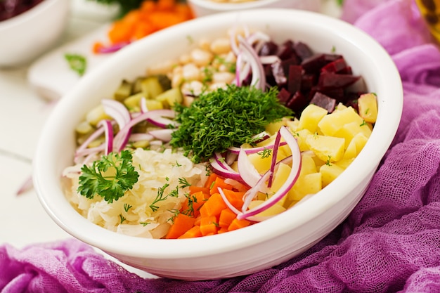 Beet salad Vinaigrette in a white bowl.