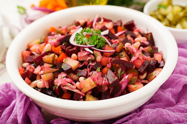 Beet salad Vinaigrette in a white bowl.