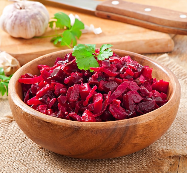 Beet salad Vinaigrette in a wooden bowl