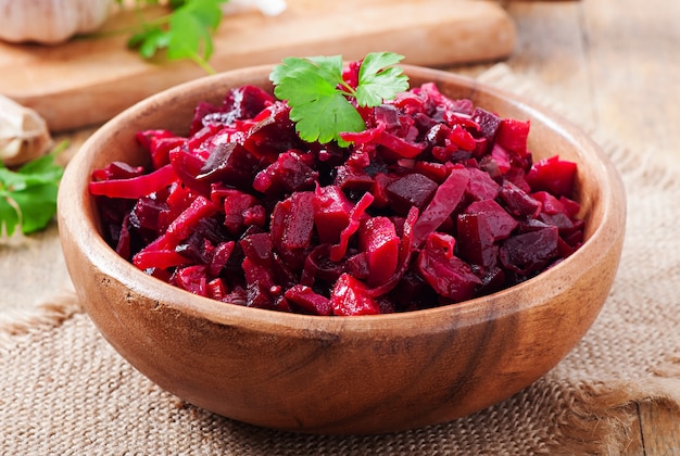 Beet salad Vinaigrette in a wooden bowl