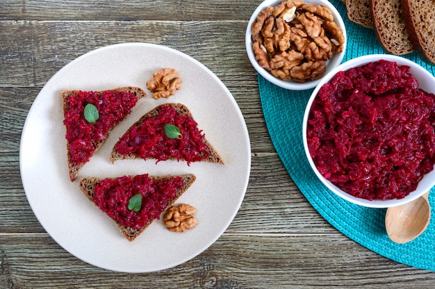 Beetroot caviar. Simple, tasty and healthy vegetable snack. Sliced rye bread with beetroot caviar. Lenten menu. Top view.