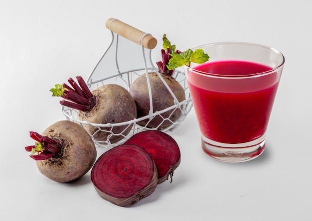 Beetroot cold pressed juice in glass, Healthy raw vegetable and fruit drink for detox. 