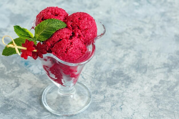 Beetroot ice cream balls in a glass vase