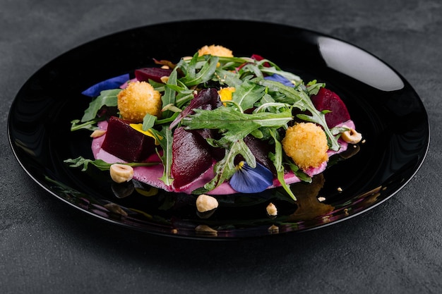 Beetroot salad with arugula and cheese balls