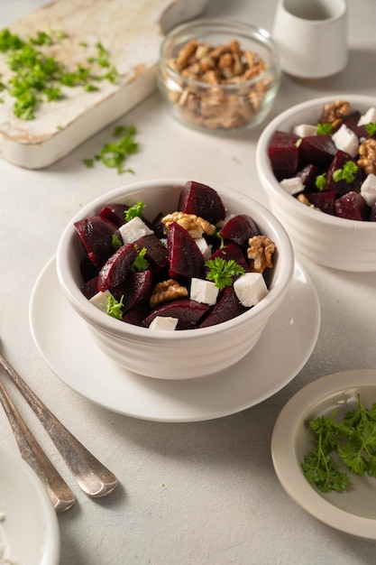 Beetroot salad with feta cheese and walnuts top view