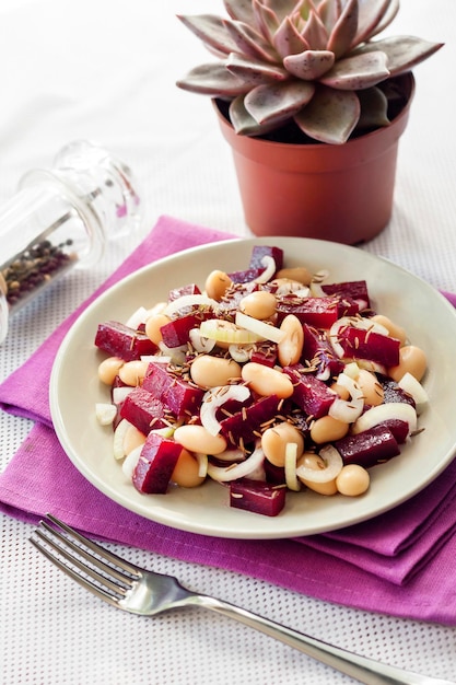 Beetroot salad with white kidney beans pickles and onion