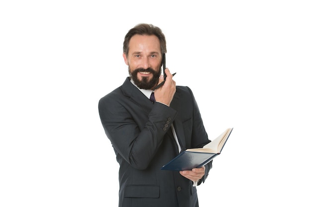 Before call write down information must convey and anything need ask client. Businessman calling client hold notepad. Man bearded manager phone conversation happy face. Successful business call.