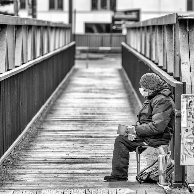 Beggar with face mask in city