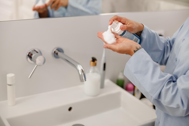 Begin your day with a refreshing skincare routine using moisturizer for a luxurious feel