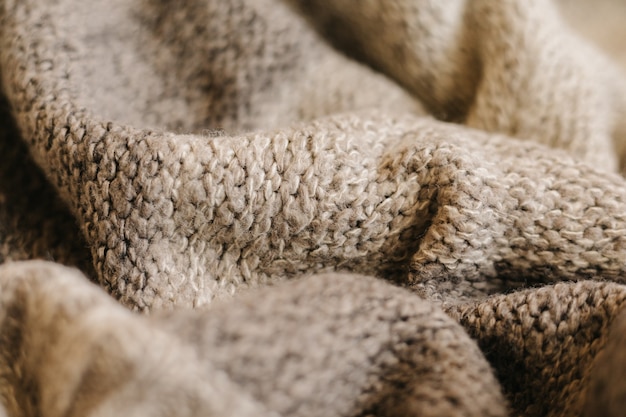 Beige autumn knitting wool texture background.