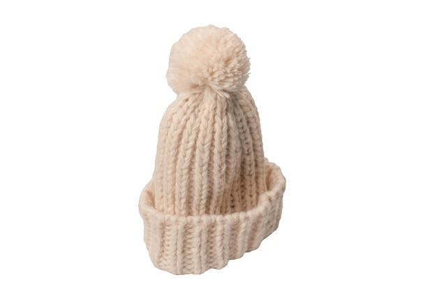 Beige beanie hat with pom pom isolated on a white background
