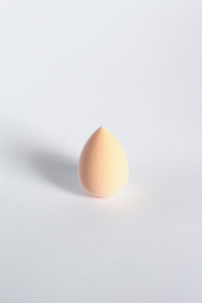 Beige beauty blender isolated on a white background