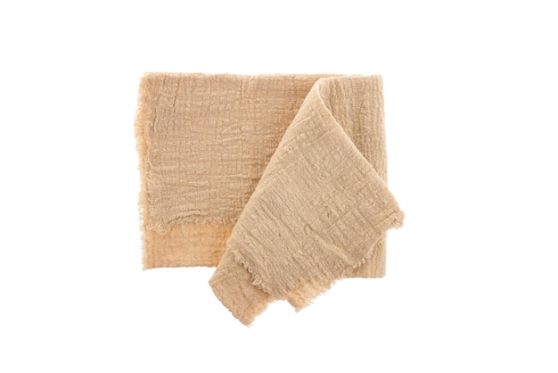 Beige cotton napkin, isolated on a white background