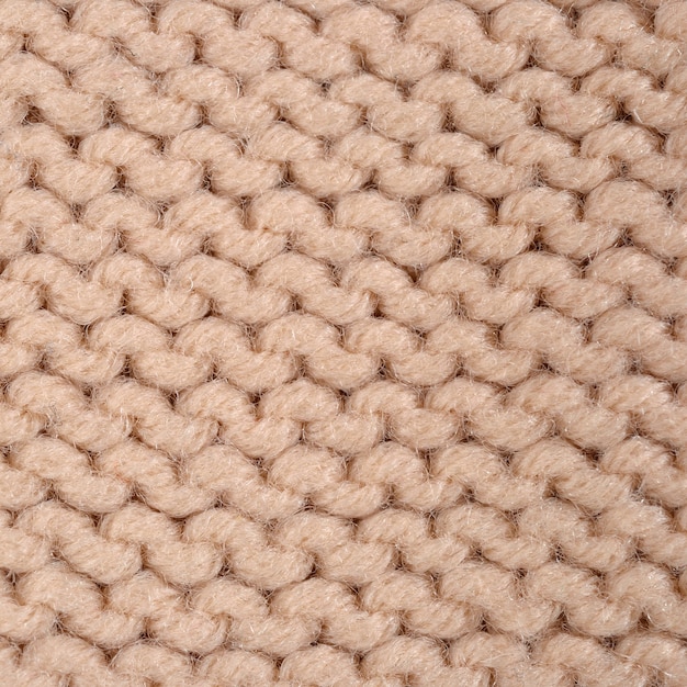 Beige gebreide stof textuur achtergrond